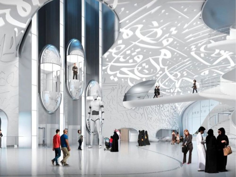 Interior view of the Museum of the Future in Dubai with visitors exploring futuristic exhibits and Arabic calligraphy designs.