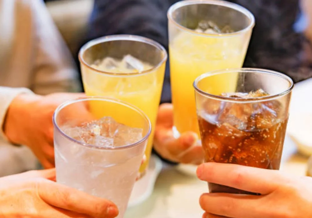 "Soft drink glasses illustrating UAE new sugar tax changes”