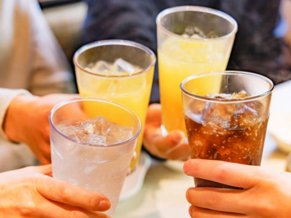 "Soft drink glasses illustrating UAE new sugar tax changes”