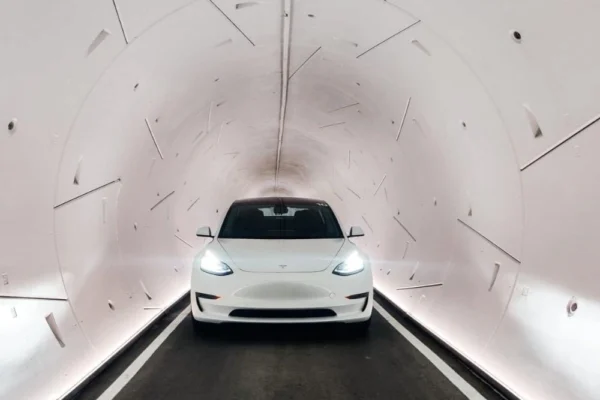 Electric vehicle traveling inside the Dubai Loop tunnel system, representing future urban mobility.