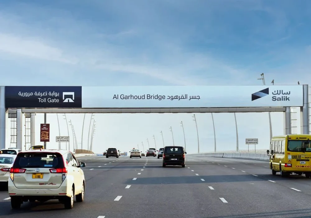 “Car passing through Salik gate in early morning during Dubai Run 2025 event”