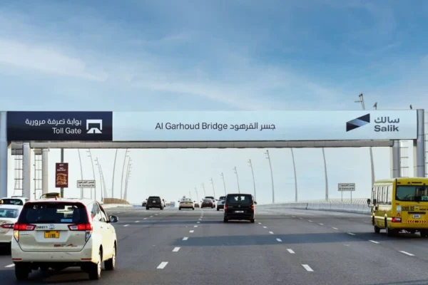 “Car passing through Salik gate in early morning during Dubai Run 2025 event”