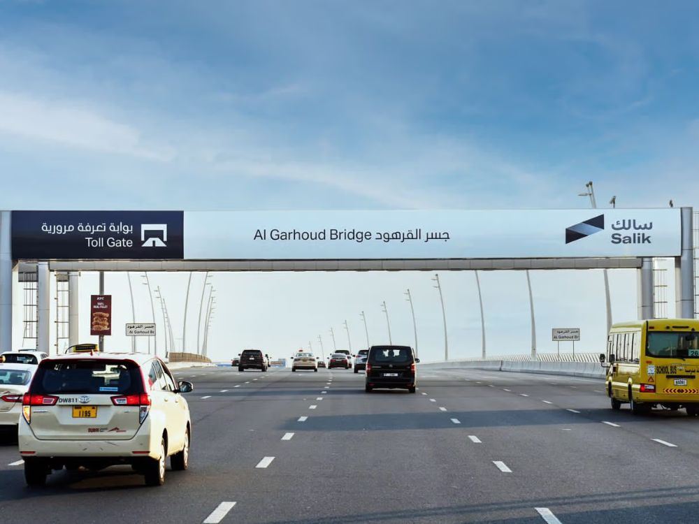 “Car passing through Salik gate in early morning during Dubai Run 2025 event”